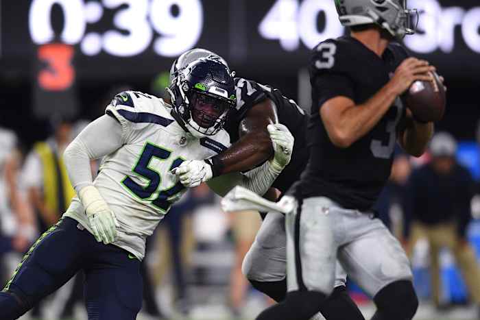 NFL: Seattle Seahawks at Las Vegas Raiders Aug 14, 2021; Paradise, Nevada, USA; Seattle Seahawks defensive end Darrell Taylor (52) pressures Las Vegas Raiders quarterback Nathan Peterman (3) during the second half at Allegiant Stadium. Mandatory Credit: Orlando Ramirez-USA TODAY Sports